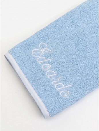 Light blue Baby towel with white outline and white italic font embroidery